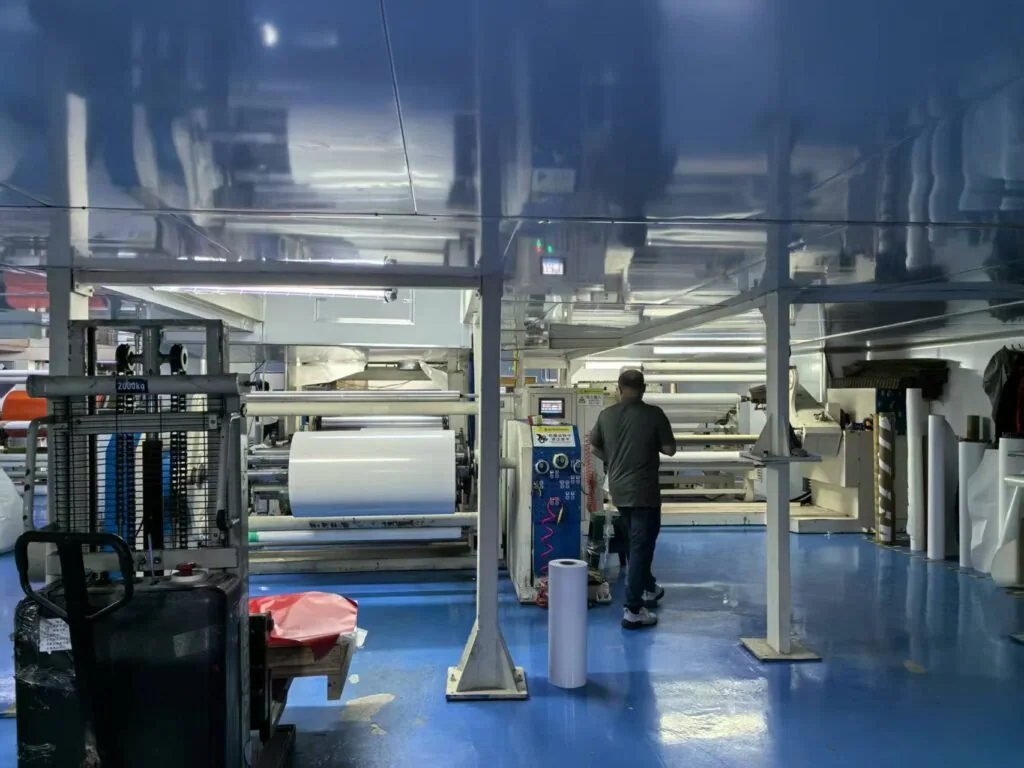 Production floor handling jumbo rolls for OEM and private-label runs