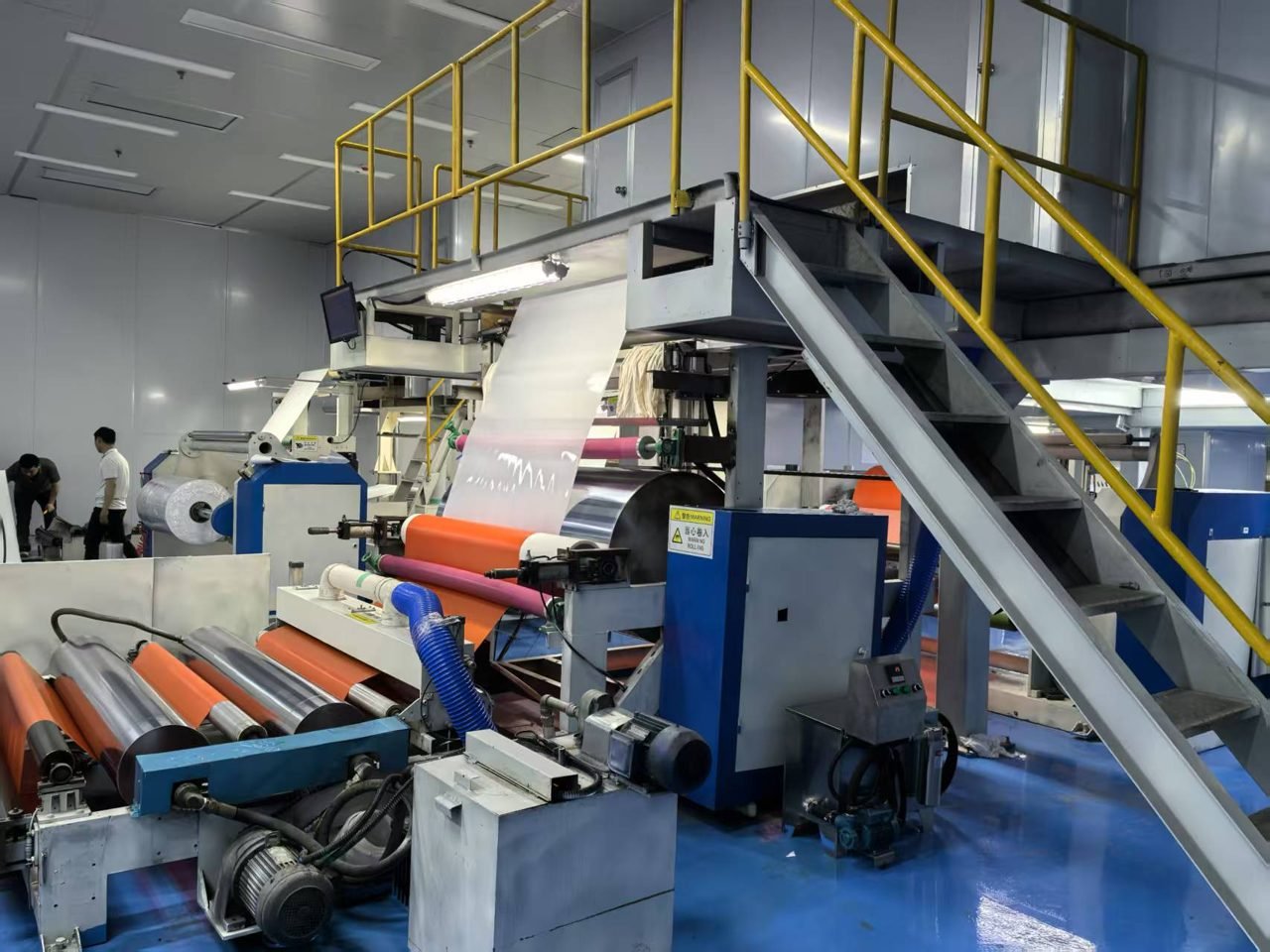 Roll processing machinery with orange rollers in the Jiangxi plant