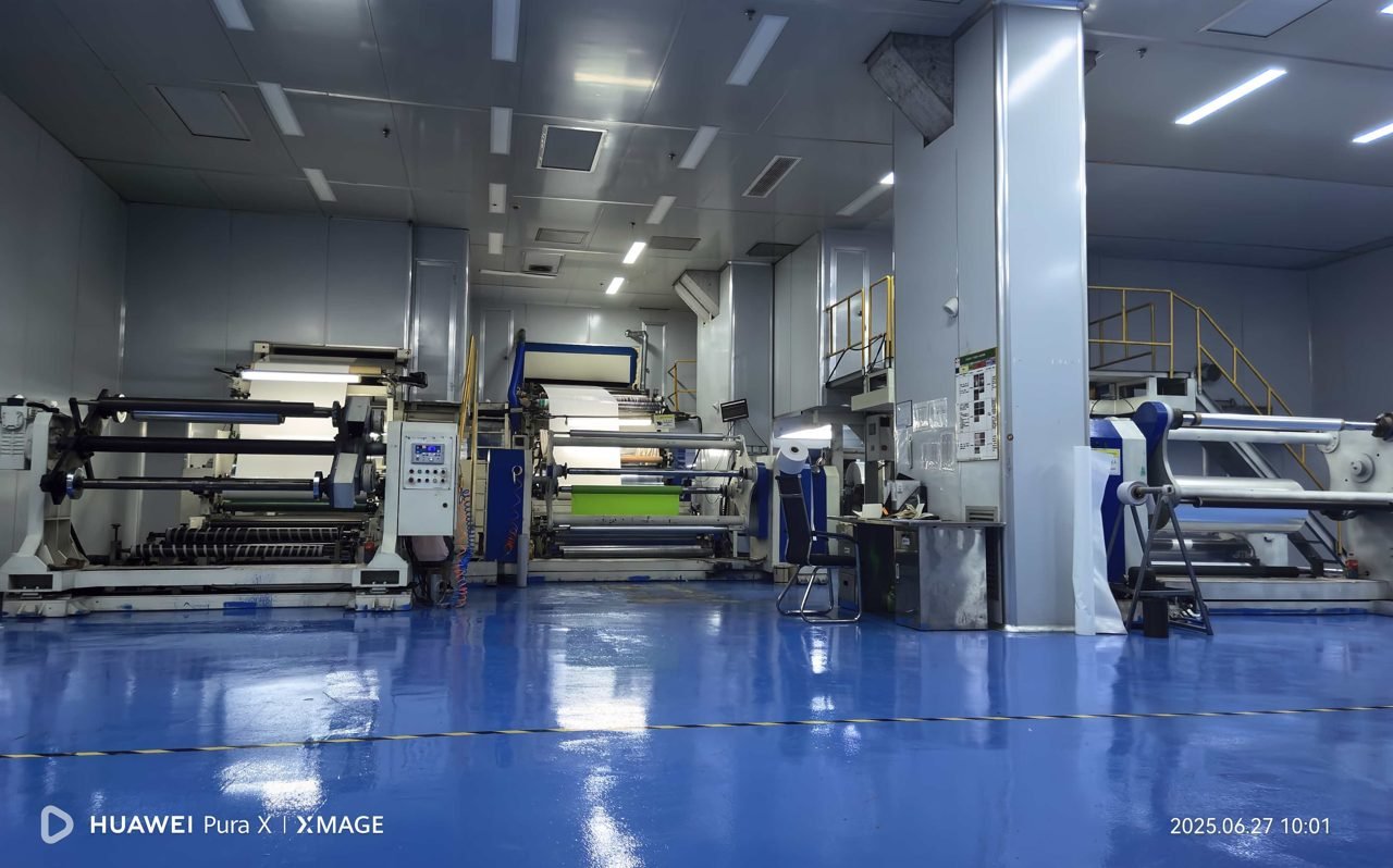 Industrial machinery control panels in a bright production hall