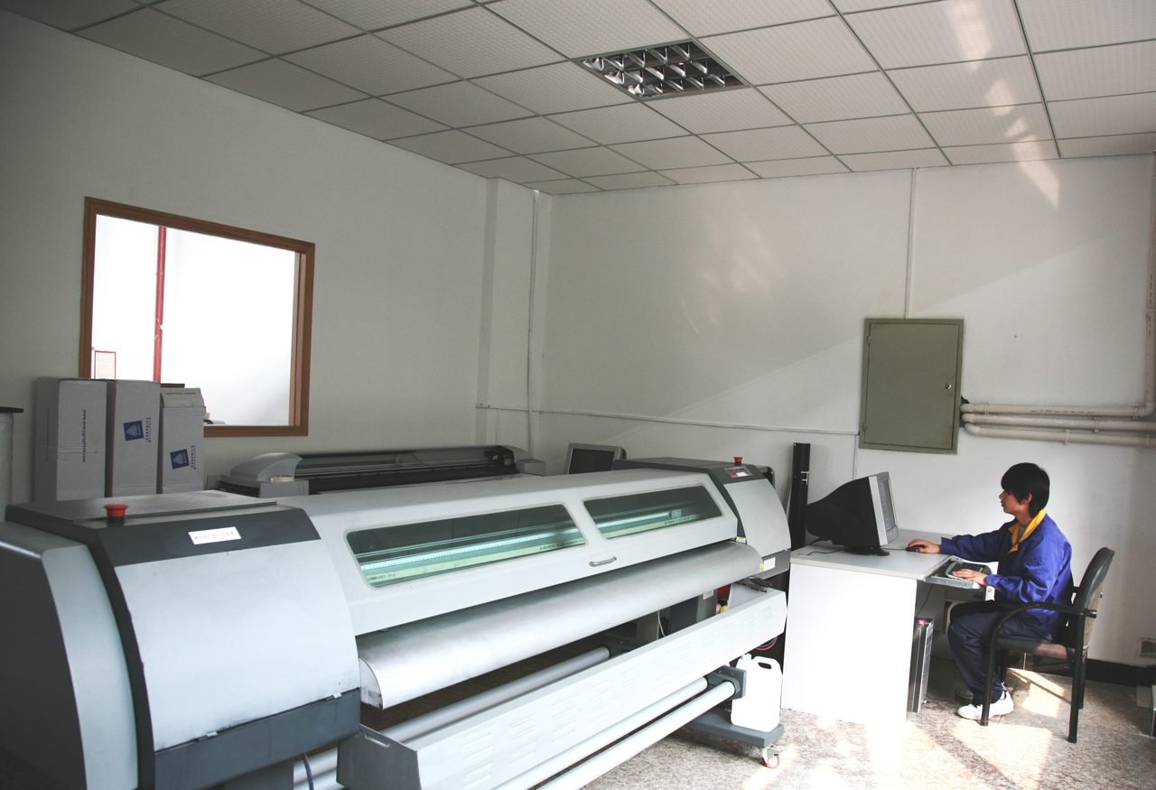 Printing station next to an industrial press